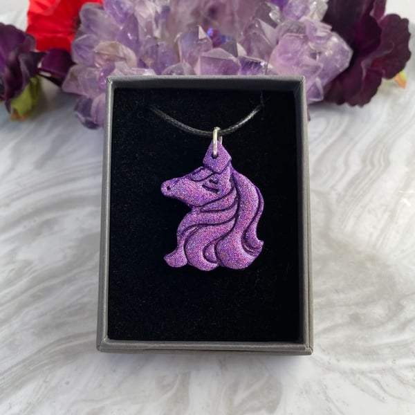 Purple unicorn glitter statement pendant on a black cord necklace, polymer clay