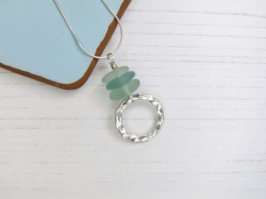 Sea Foam Cornish Sea Glass Pendant with a Hammered Silver Circle