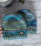 Paid of blue-green beanies