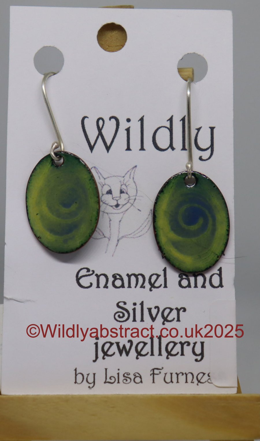 Green enamel earrings with blue stencil