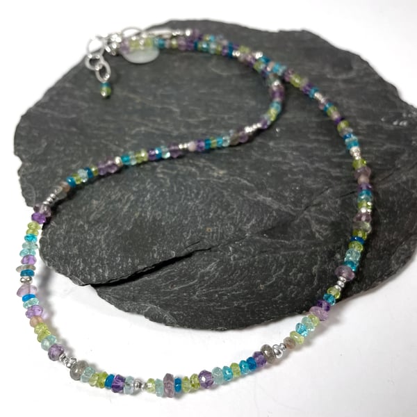 Faceted gemstone necklace in peacock colours