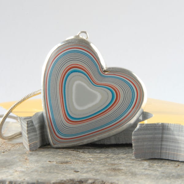 Heart shaped fordite pendant