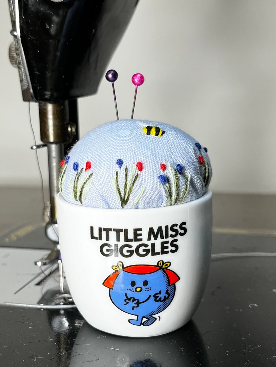 Little Miss Giggles egg cup embroidered pin cushion with bee and flowers