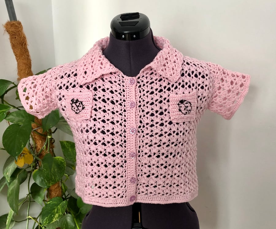Ladies crochet crop shirt. Short sleeves. Baby pink. Black. Pockets. Size 4. 