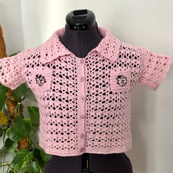 Ladies crochet crop shirt. Short sleeves. Baby pink. Black. Pockets. Size 4. 