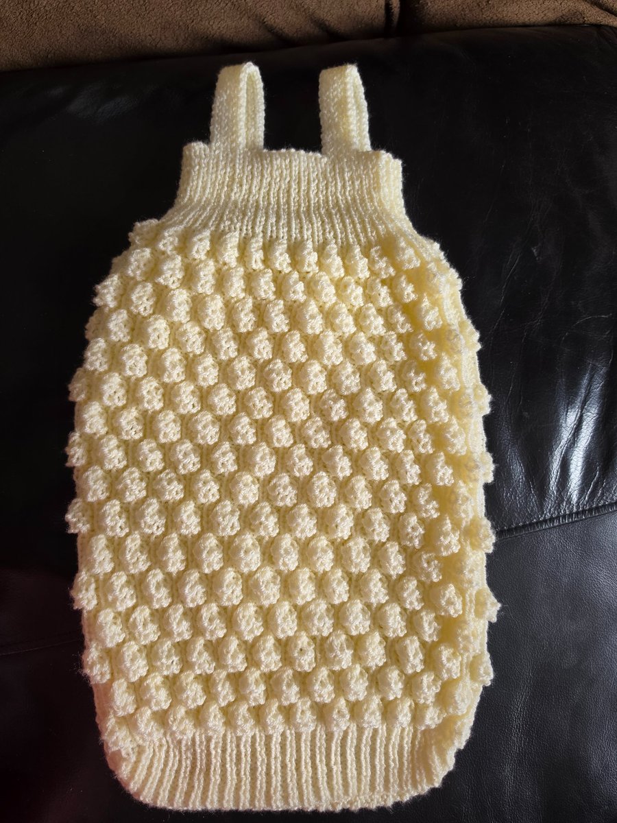 Hand knit sleeveless sleeping bag. 