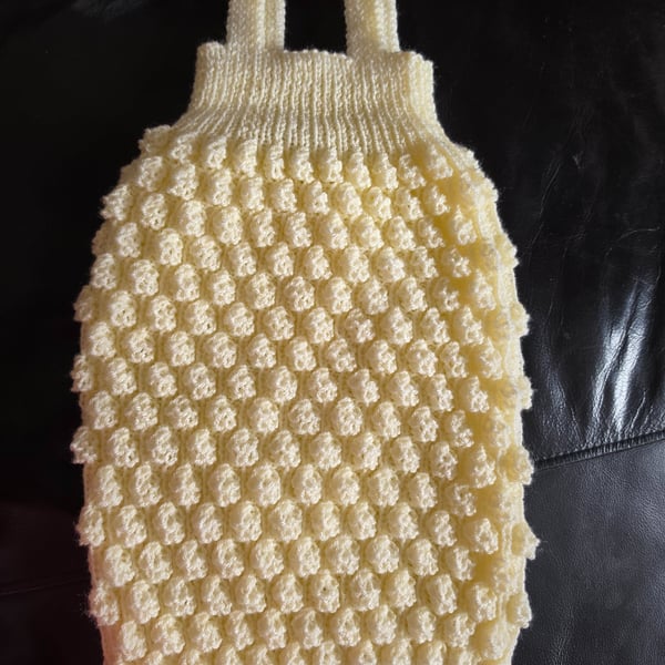 Hand knit sleeveless sleeping bag. 