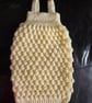 Hand knit sleeveless sleeping bag. 