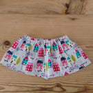 Baby skirt in a bright houses pattern fabric age 9-12 months.