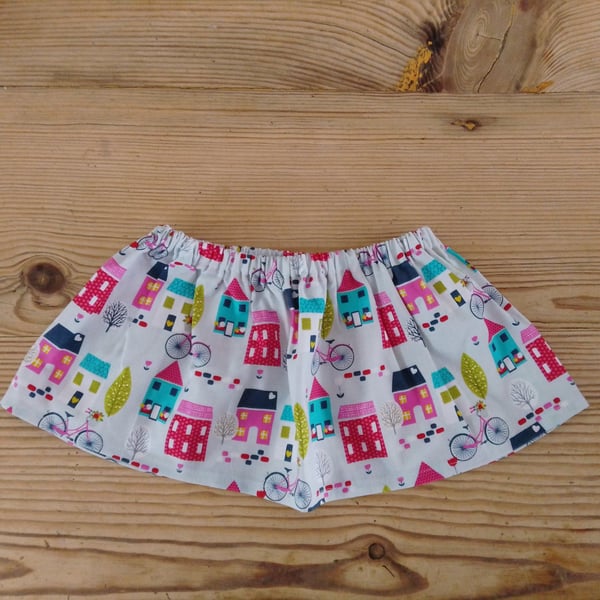 Baby skirt in a bright houses pattern fabric age 9-12 months.