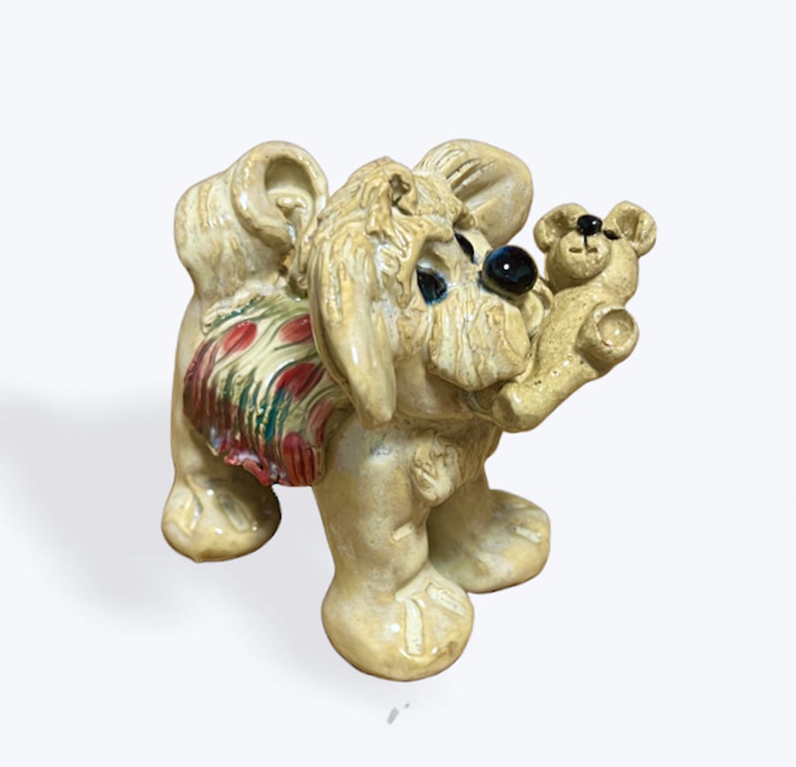 Handcrafted Ceramic Dog carrying his Teddy Bear - just the cutest