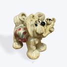 Handcrafted Ceramic Dog carrying his Teddy Bear - just the cutest