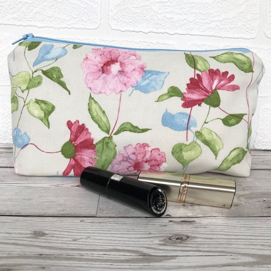 Cosmetic bag, make up bag in cream with pastel pink, green and blue floral print