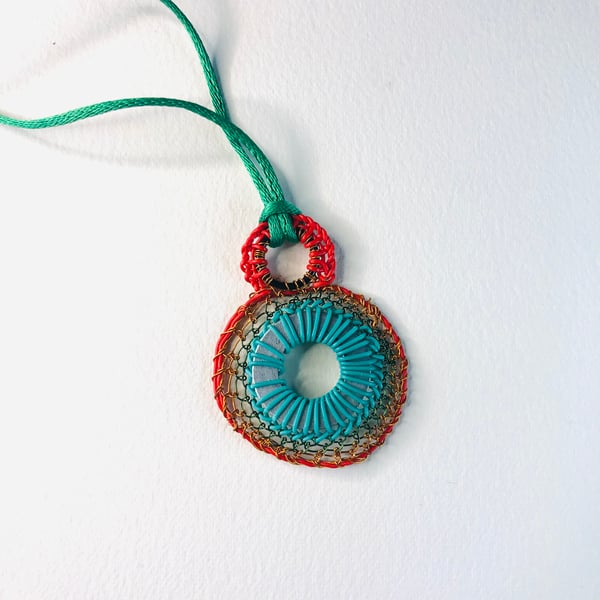 Stitched washer pendant from recycled and found materials