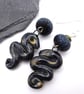 black lampwork glass and ceramic serpent earrings - Image 1