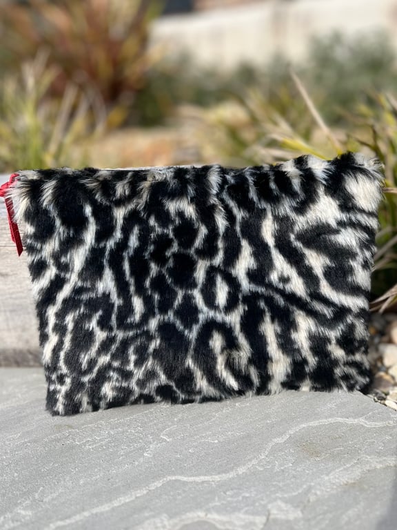 Leopard print faux fur zip pouch clutch bag