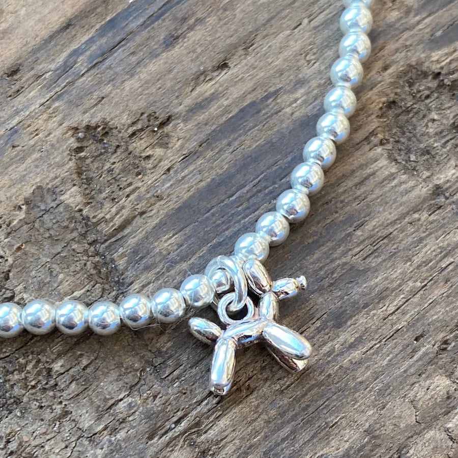 Sterling silver bead bracelet with balloon dog charm. Stretch bracelet. 