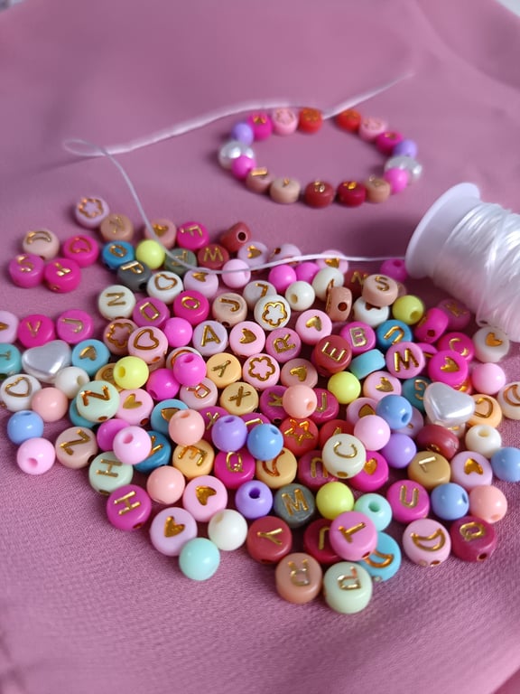 Small bracelet making kit including alphabet beads and many decorative beads
