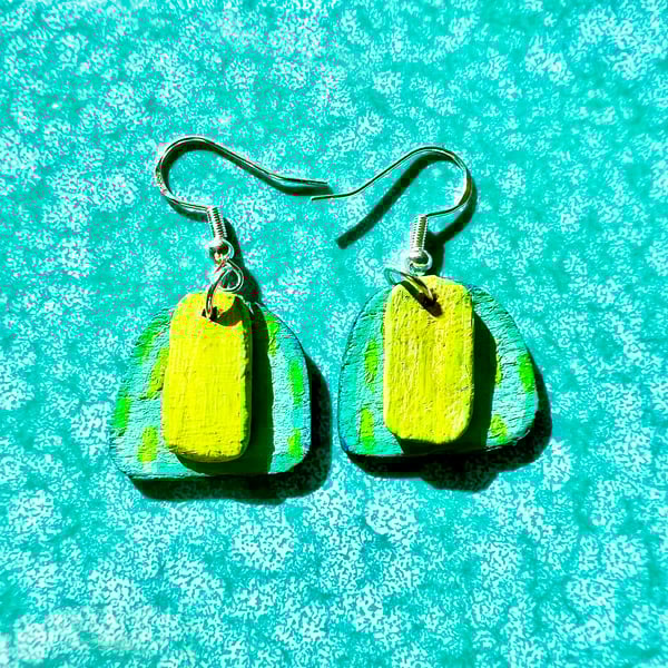Wooden dangly earrings painted in vibrant greens and teal on silver plated hooks