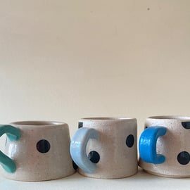 3 spot ceramic cups.