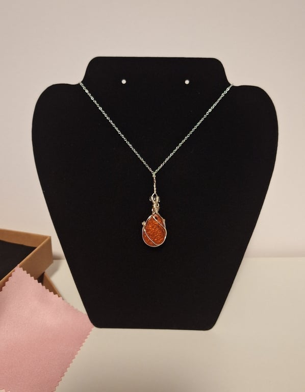 Amber colour resin and sterling silver pendant