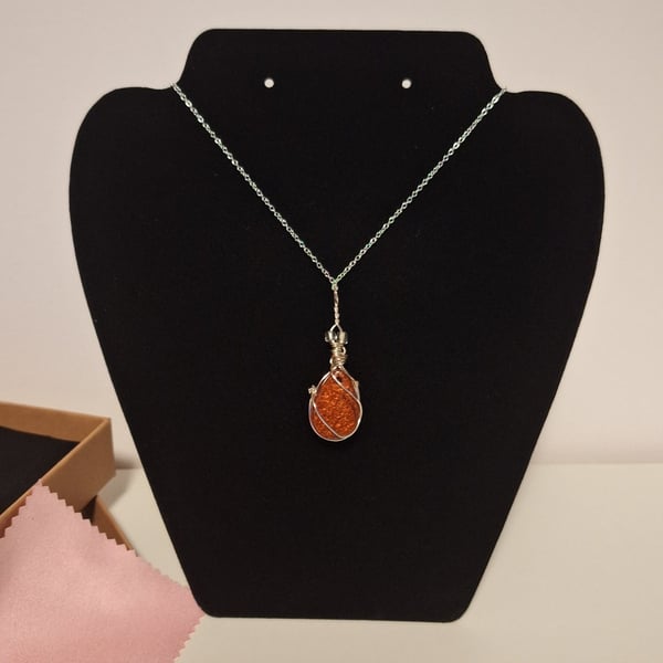 Amber colour resin and sterling silver pendant