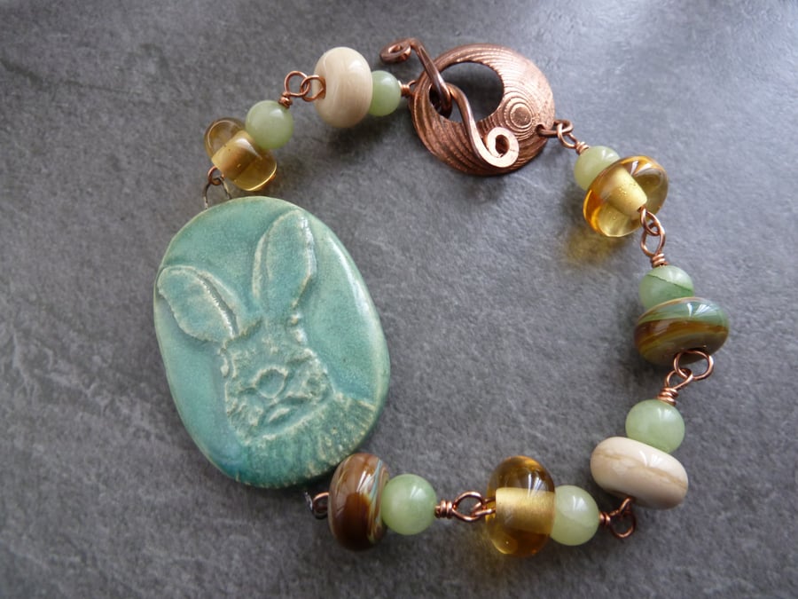green ceramic hare, lampwork and copper bracelet