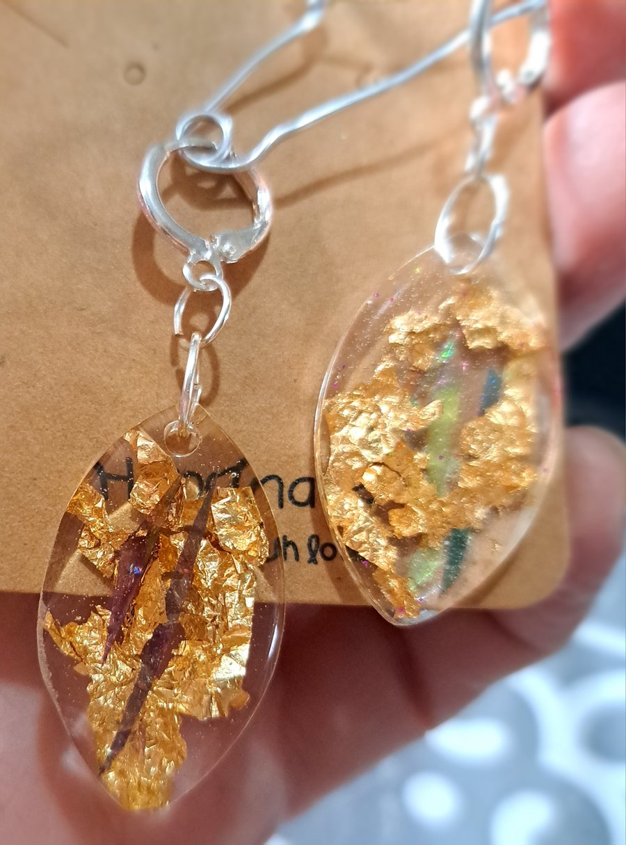 Oval shaped resin earrings with dichroic film and gold leaf