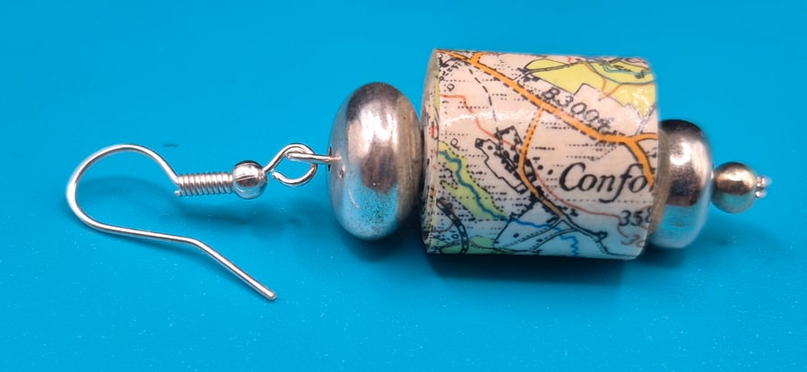 Barrel paper beaded earrings made with old OS map of Chichester and silvery bead