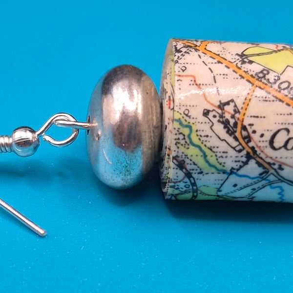 Barrel paper beaded earrings made with old OS map of Chichester and silvery bead