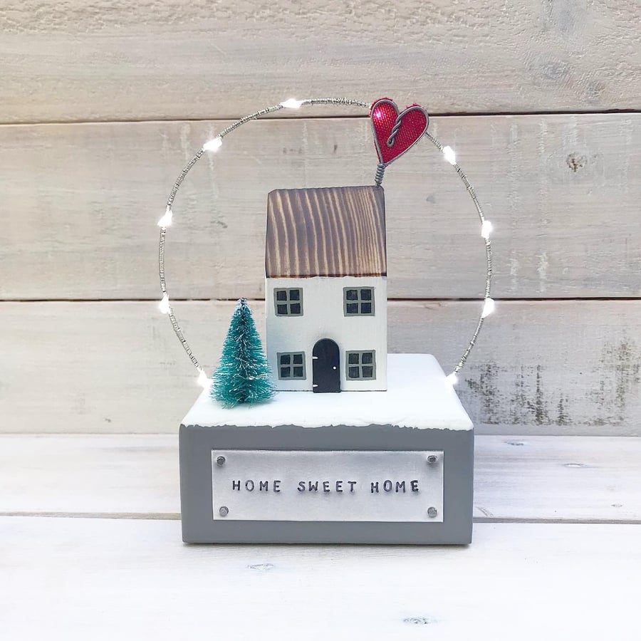 Winter House with Snow and Lights