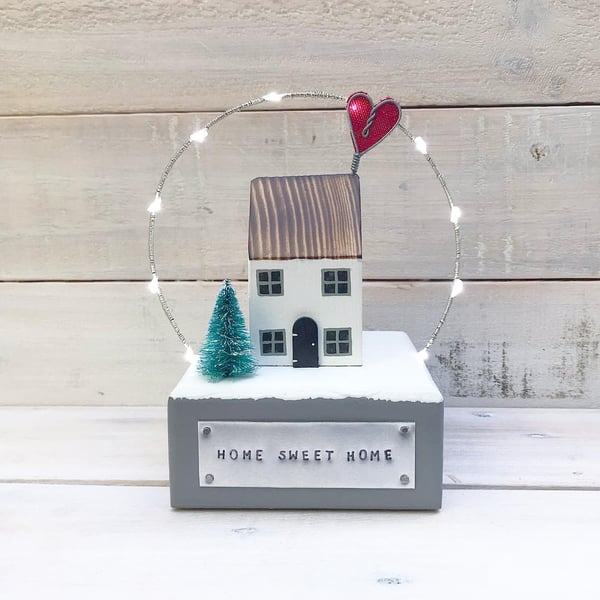 Winter House with Snow and Lights