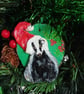 Christmas tree decoration of a Badger with a santa hat made from air dry clay.   - Image 1