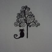 The Cat And The Holly Tree 