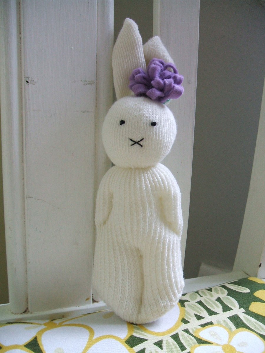 Cute bunny soft toy with lilac flower