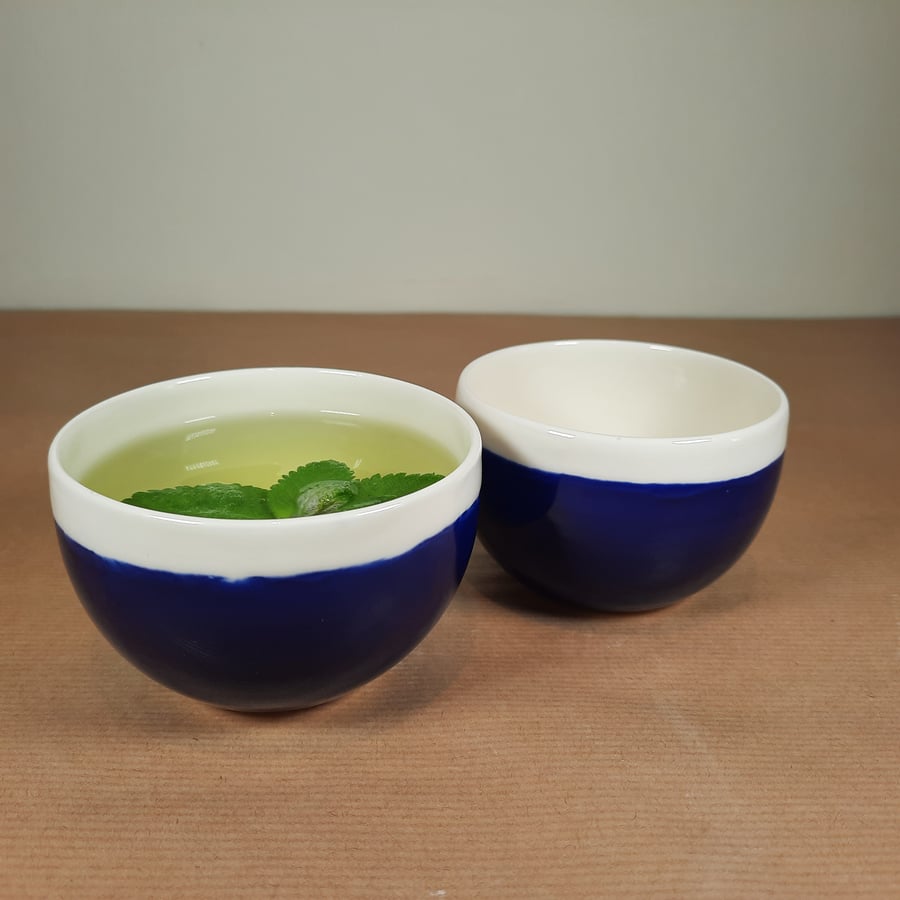 TWO HAND MADE BLUE AND WHITE PORCELAIN CHINESE TEA BOWLS