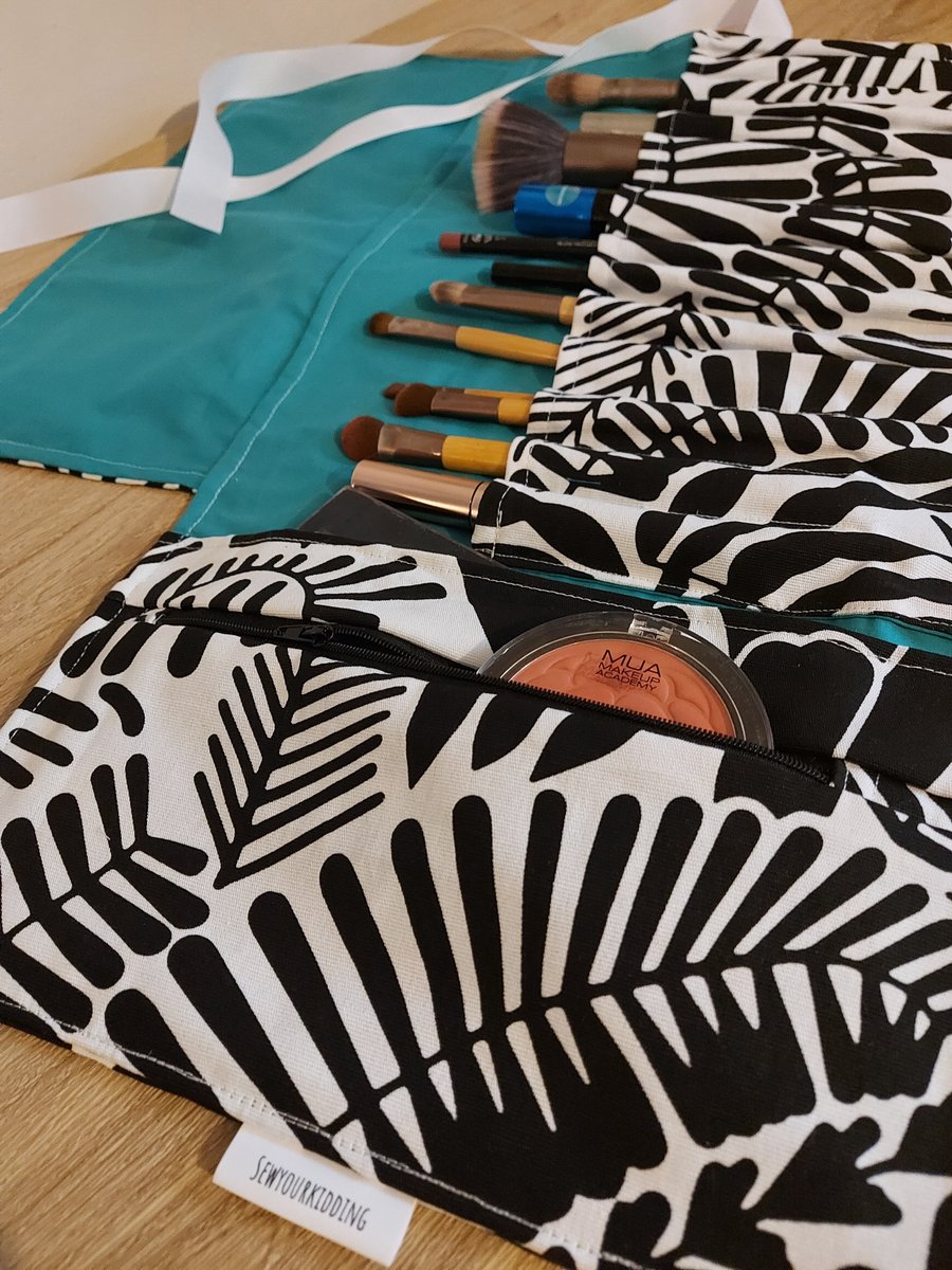 Monacrome and teal make up bag and brush role 