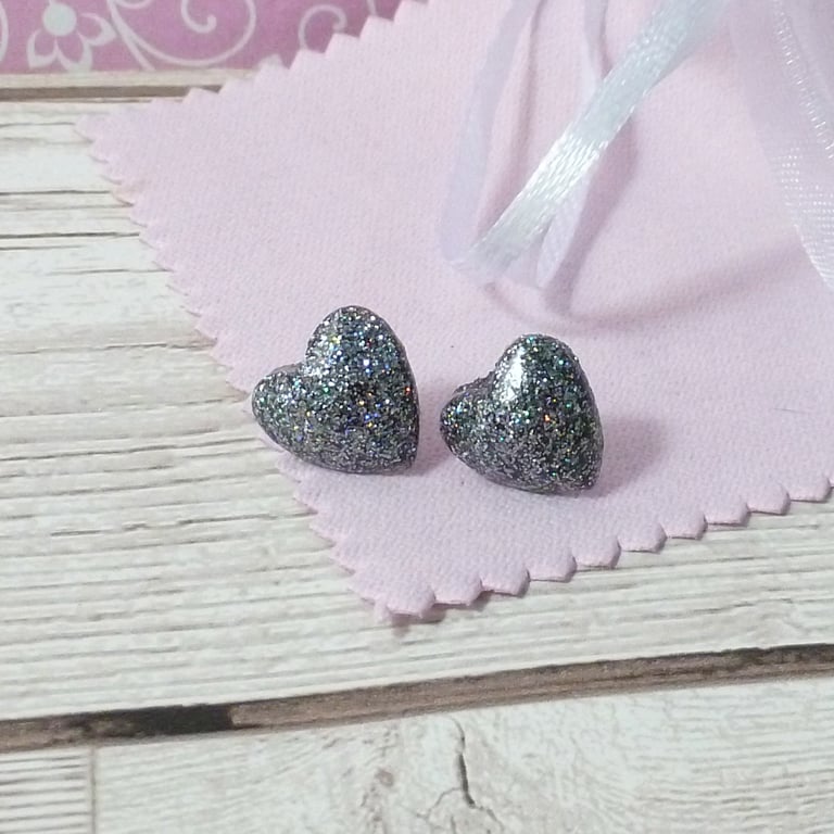 Holographic silver heart stud earrings. Sparkly silver glitter heart studs
