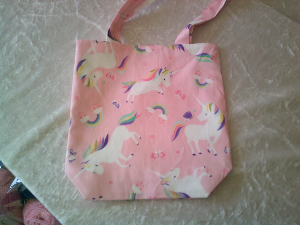 Unicorns and Rainbows on a Pink background Shoulder Bag