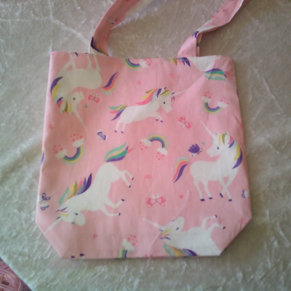Unicorns and Rainbows on a Pink background Shoulder Bag