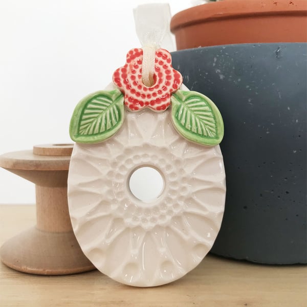 Pottery Easter Egg decoration with dark orange flower