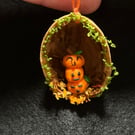 Little pumpkin stack in a walnut shell