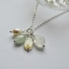 Semi-precious gemstone and pearl charm cluster pendant in pale tones