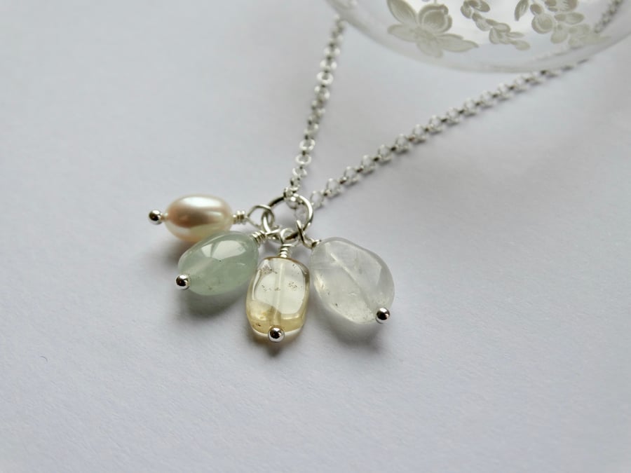Semi-precious gemstone and pearl charm cluster pendant in pale tones