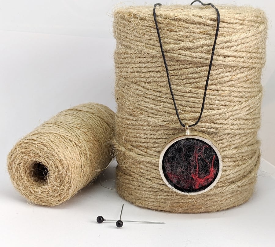 Felted pendant - black and red abstract in silver bezel