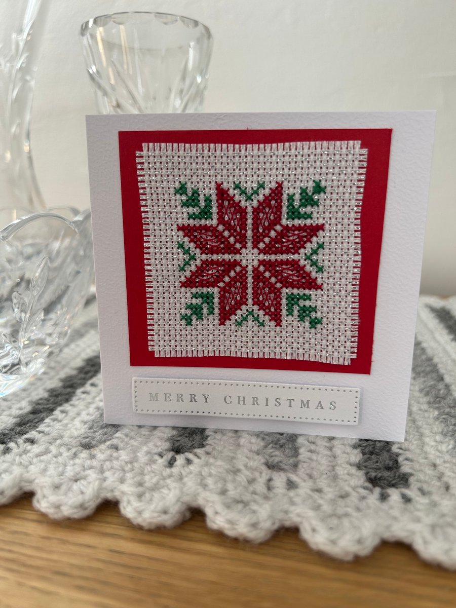 Cross stitched blank Christmas card with a Poinsettia 