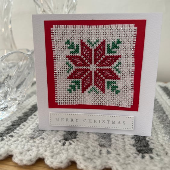 Cross stitched blank Christmas card with a Poinsettia 