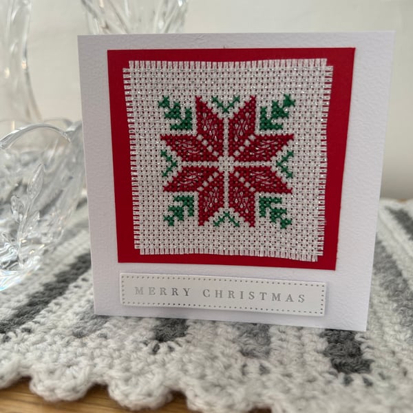 Cross stitched blank Christmas card with a Poinsettia 