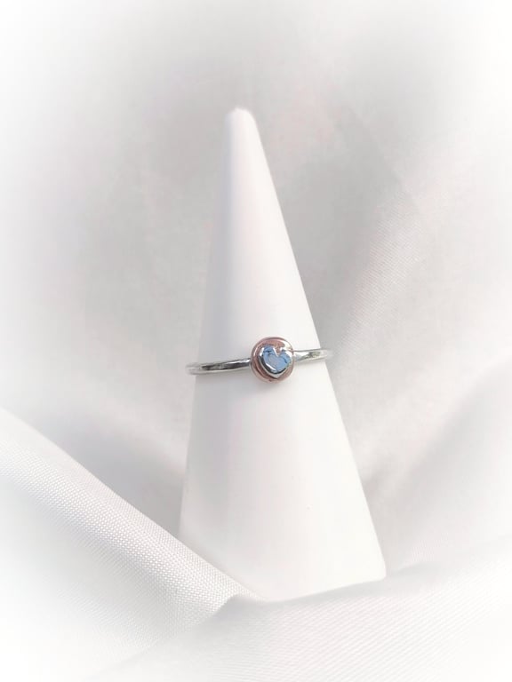 Silver ring with heart on the copper disc