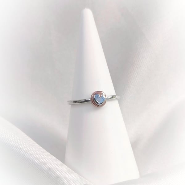 Silver ring with heart on the copper disc